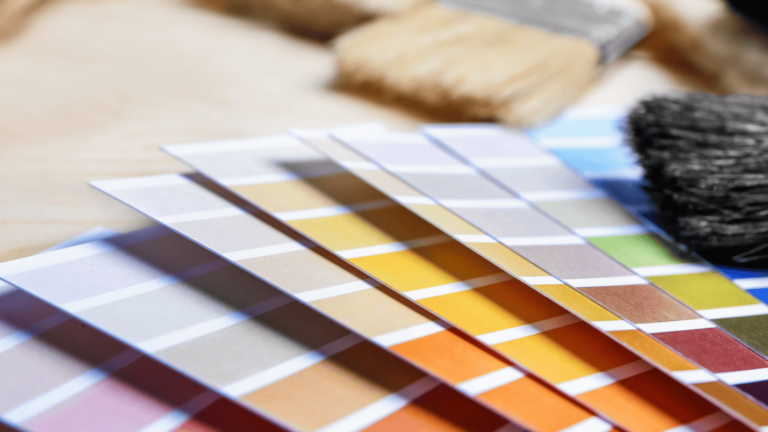 A close up image of paint samples and brushes