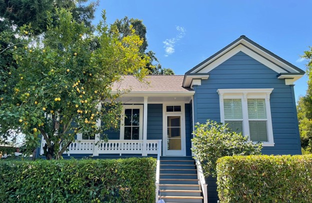 A home exterior newly painted in a beautiful blue color.