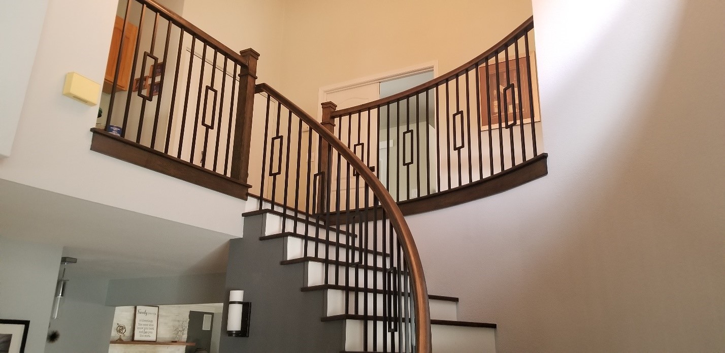 A stairway inside a modern home that has been newly painted.