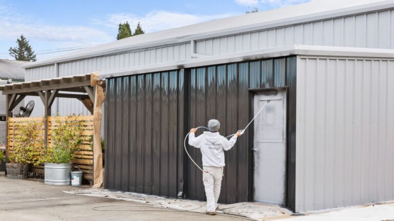 The exterior of a commercial building being painted by a professional