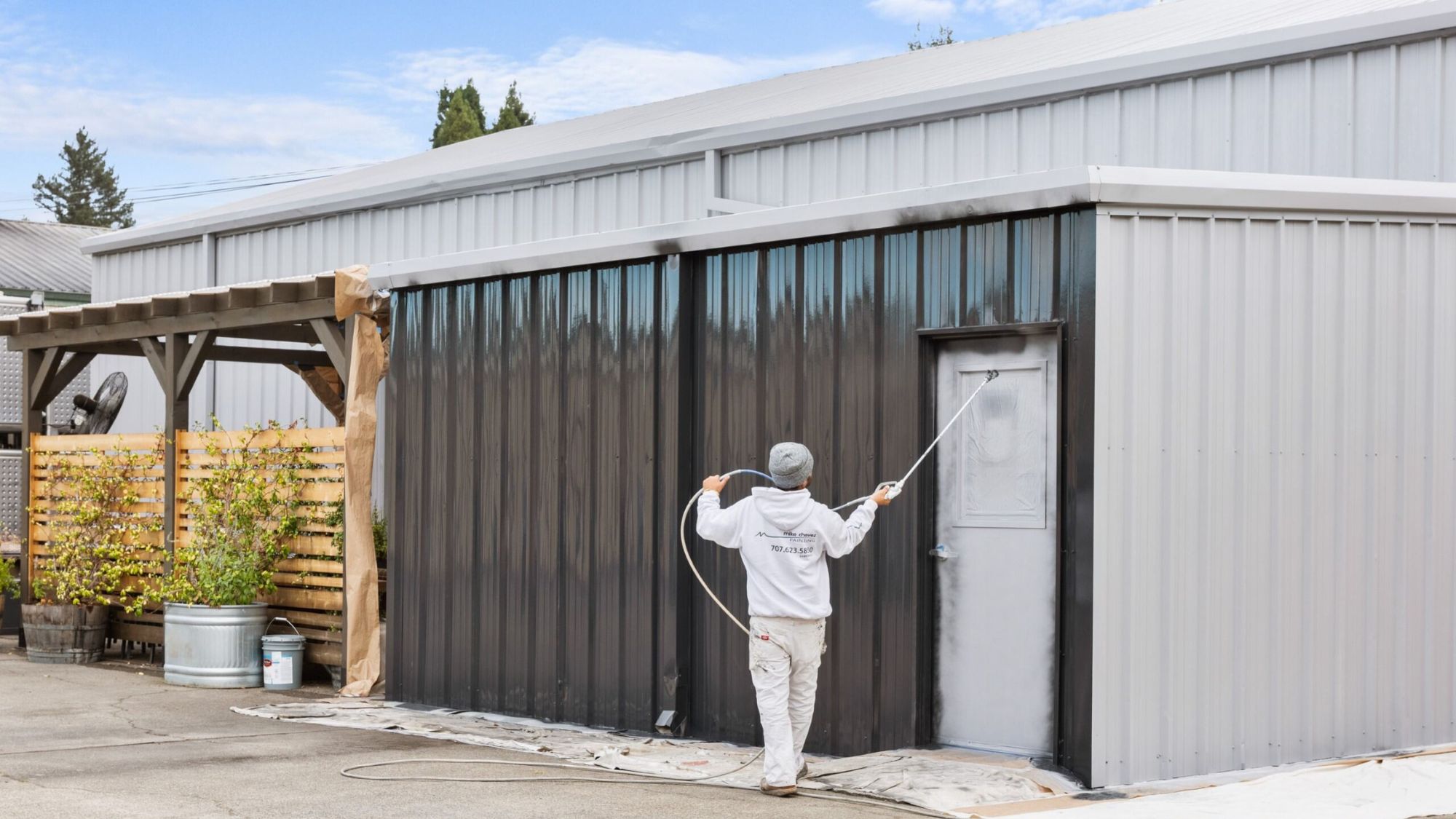 The exterior of a commercial building being painted by a professional
