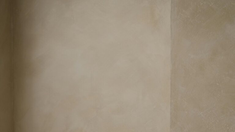 Walls of a home that have been limewashed a light beige color