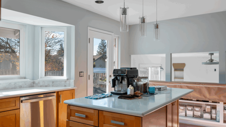 A home kitchen with freshly painted walls in a light slate color